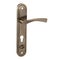 Glossy bronze spiral door handle on a narrow profile strip with a downward curve and pivot mechanism