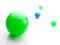 Glossy green and blue spheres on white.