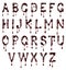 Glossy large letters of the Latin alphabet made of chocolate with dripping drops isolated on a white background