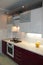 Glossy modern kitchen with white top and cherry bottom