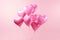 Glossy Pink Heart Balloons Floating Serenely