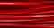 A glossy pleated silk curtain texture for use as a red background.