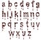 Glossy small letters of the Latin alphabet made of chocolate with dripping drops isolated on a white background
