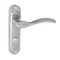 Glossy spiral door handle on a strip, silver-colored with twist mechanism