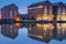 Gloucester docks warehouses reflected in quay on Sharpness Canal