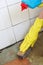 Gloved hand cleaning of dirty filthy floor
