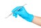 Gloved hand holding a metal dental tool trowel two-way,