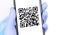 Gloved hand holding a smartphone with qr code on the screen. Stopcoronavirus.rf - website you can find detailed