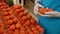 Gloved hands of female grocery store staff at work