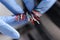 Gloved master holds colored electronic wires closeup