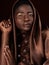 That glow that comes from your soul. Studio portrait of an attractive young woman posing in traditional African attire