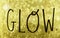 GLOW - The word glow written in freehand on golden bokeh textured background with sparkle