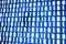 Glowing binary code on blue background