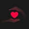 Glowing burning red heart and hands near it in darkness