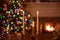 Glowing candlesticks with holiday lights in the blurred background