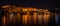 Glowing cityscape at Udaipur by night. The majestic city palace reflecting lights on Lake Pichola, travel destination in Rajasthan