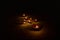 Glowing clay lamp in dark night - Happy Diwali, Light festival, Illuminated lights