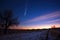 a glowing comet streaking across the midnight sky