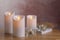 Glowing decorative LED candles on wooden table