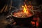glowing embers beneath jambalaya pot on open fire