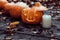 Glowing evil Halloween pumpkin on wooden old floor with dry autumn leaves