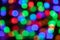 Glowing and festive colored light spots. Blurred LED lights.