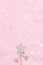 Glowing, glittering star on pink background with white beads and bokeh. Magic star, fulfillment of wishes, dreams