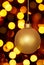 Glowing Gold Christmas Ornament And Holiday Lights