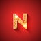 Glowing Golden Letter N on red colored background