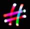 Glowing hash # symbol on dark background. Hashtag markup. Abstract night light painting. Creative artistic colorful bokeh.