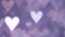 Glowing heart shaped lights sparkling on soft purple background. Romantic Valentine`s day background