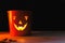 Glowing Jack-o-lantern head in dark. Happy Halloween. Jack o lantern glowing face pumpkin on black background. Trick or treat.