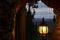 Glowing lantern at night on the cave window.