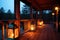 glowing lanterns on cabin porch at dusk