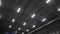 Glowing led lamps on high ceiling in spacious warehouse
