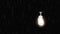 Glowing light bulb is hanging and rain falling around the light bulb dark black background. Rain falling on lamp 3D Seamless
