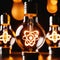 Glowing light bulbs with atomic energy symbol, showing nuclear powered electricity