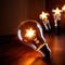 Glowing lightbulbs with star symbols, symbolizing bright future with successful hopes and dreams