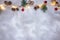 Glowing lights garland decorated with pine cones and jingle bells