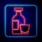 Glowing neon Alcohol drink Rum bottle and glass icon isolated on blue background. Vector