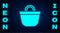 Glowing neon Beach bag icon isolated on brick wall background. Vector