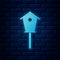 Glowing neon Bird house icon isolated on brick wall background. Nesting box birdhouse, homemade building for birds