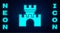 Glowing neon Castle icon isolated on brick wall background. Medieval fortress with a tower. Protection from enemies. Reliability