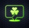 Glowing neon Clover trefoil leaf icon isolated on brick wall background. Happy Saint Patricks day. National Irish