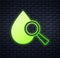 Glowing neon Drop and magnifying glass icon isolated on brick wall background. Vector