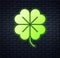 Glowing neon Four leaf clover icon isolated on brick wall background. Happy Saint Patrick day. Vector