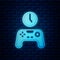 Glowing neon Gamepad of time icon isolated on brick wall background. Time to play games. Game controller. Vector