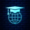 Glowing neon Graduation cap on globe icon isolated on brick wall background. World education symbol. Online learning or