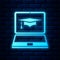 Glowing neon Graduation cap and laptop icon. Online learning or e-learning concept icon isolated on brick wall
