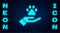 Glowing neon Hands with animals footprint icon isolated on brick wall background. Pet paw in heart. Love to the animals